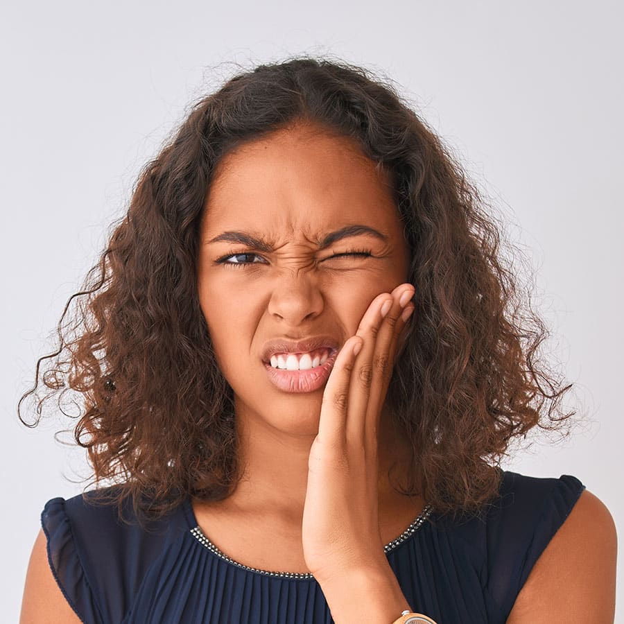 Young woman with tooth pain